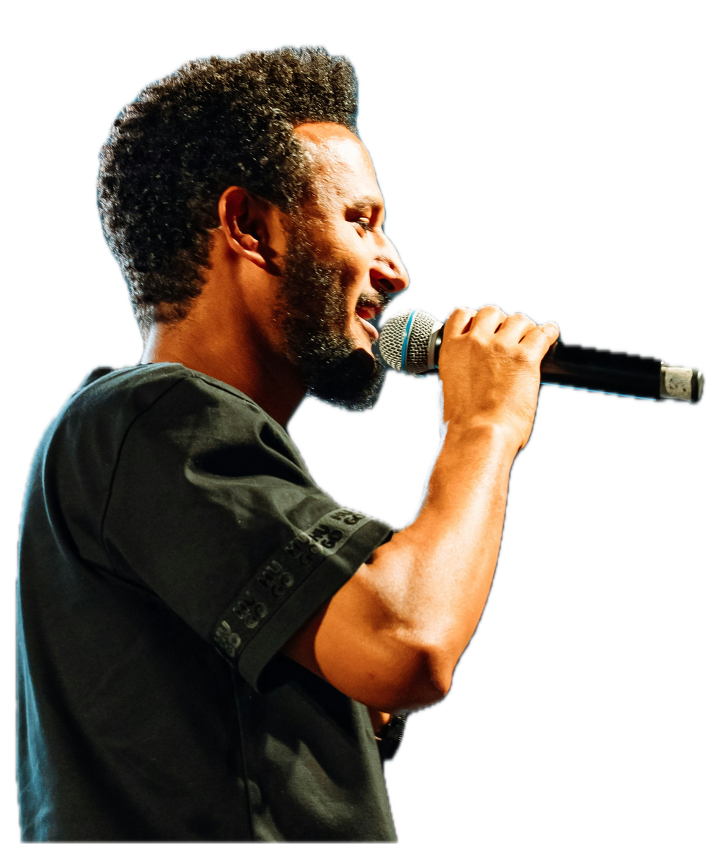 Cutout of a singer performing into a microphone under stage lighting