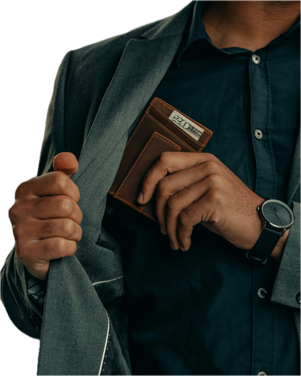 Cutout of a man in a suit tucking a wallet into his jacket pocket